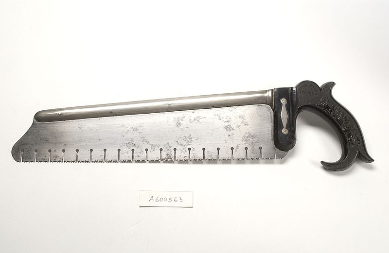 a bone saw against a white background