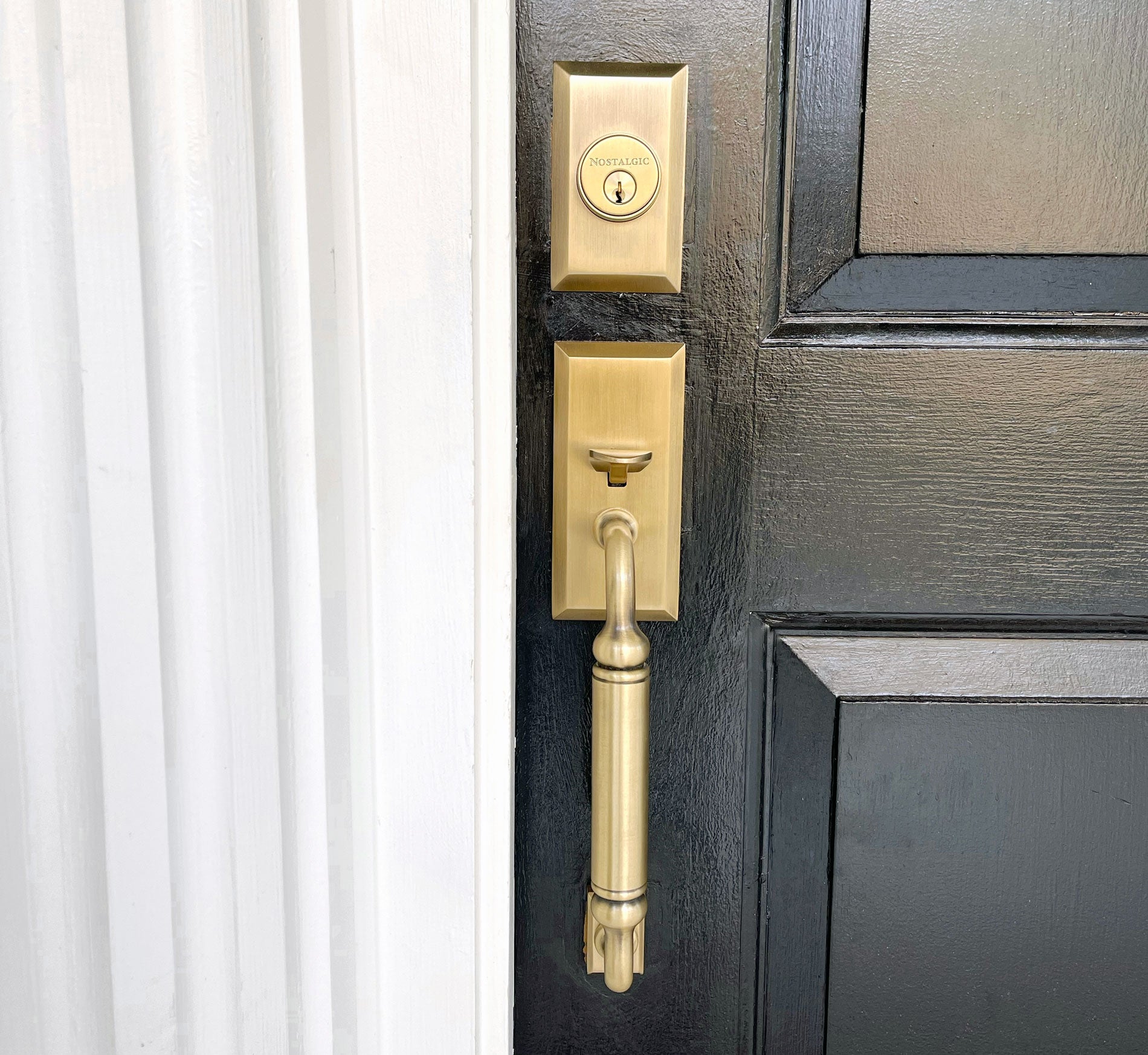 black front door with brass hardware